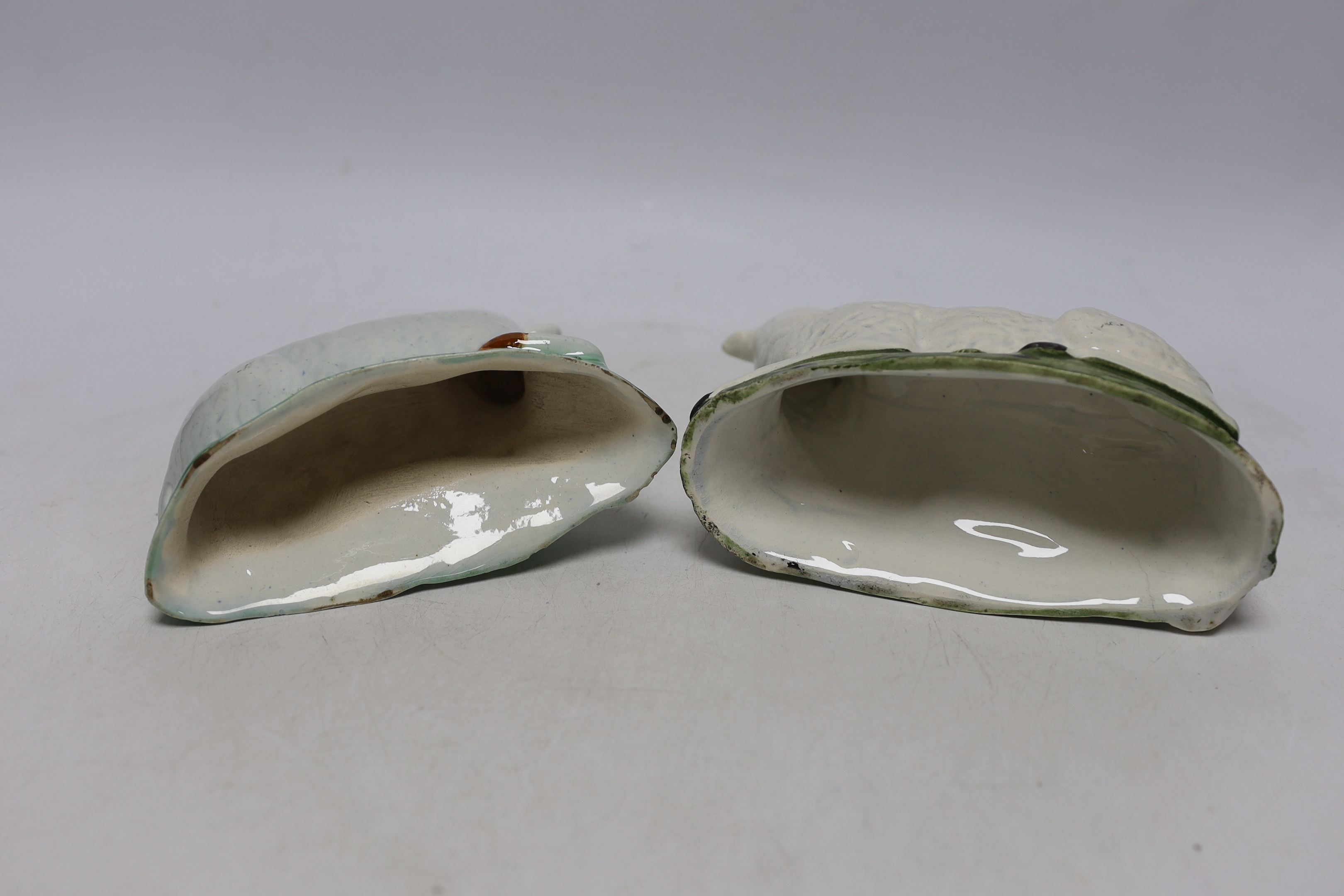 Two late 18th/early 19th century Staffordshire pottery models of recumbent sheep, 16cm wide